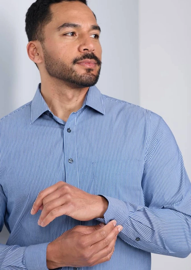 A classic fit long sleeve shirt in blue and white stripes, featuring button cuffs and a logo on the sleeve.