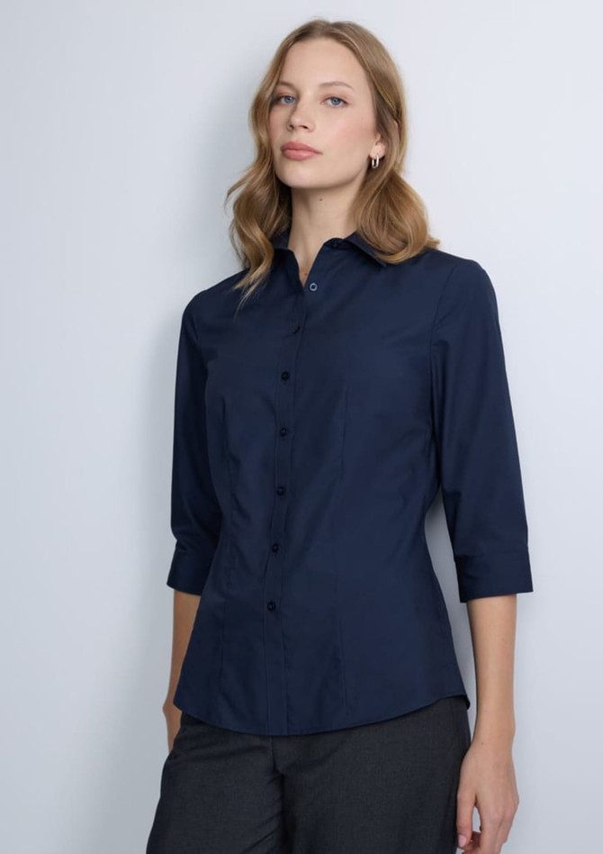 A navy blue women's 3/4 sleeve shirt with a collared neckline and buttons down the front, featuring a logo on the chest.