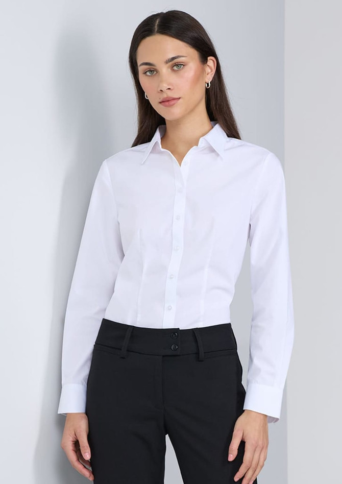 A white long sleeve shirt with a collared neck, displayed on a model wearing black pants. Features a logo.