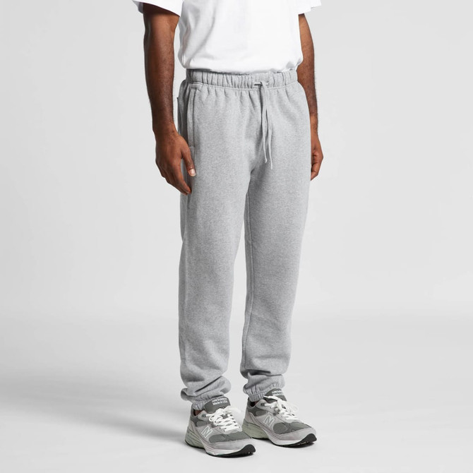 Grey track pants displayed on a person, featuring an elastic waistband and cuffs, with a logo present.