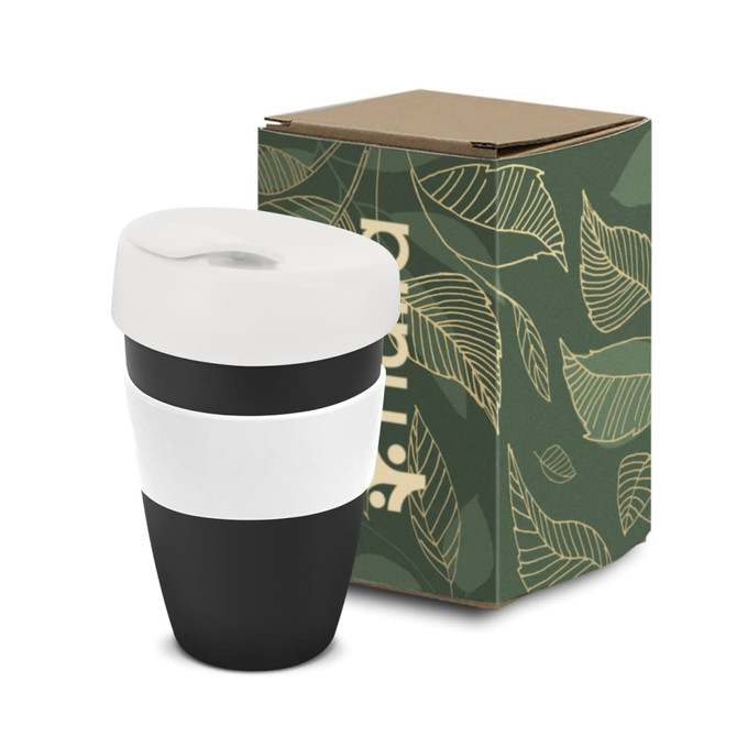 A drink bottle in black and white, featuring a lid and a white band, accompanied by a green boxed packaging with leaf design.