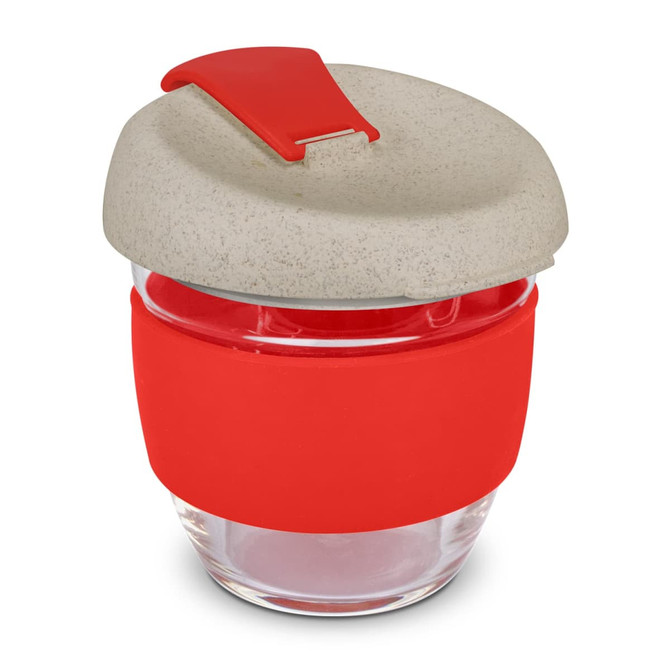 A drink bottle made of clear glass with a grey lid and a red silicone band around the middle.