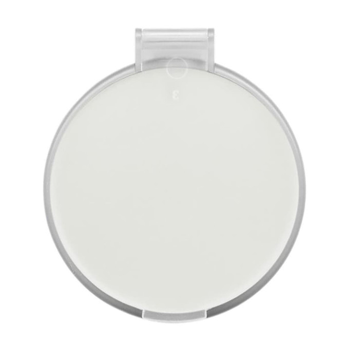 A compact mirror featuring a round design with a clear outer casing and a smooth, reflective surface.