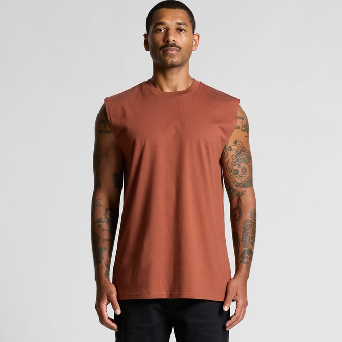 A man wearing a sleeveless, burnt orange tank top with a plain design. The top has a logo on it.