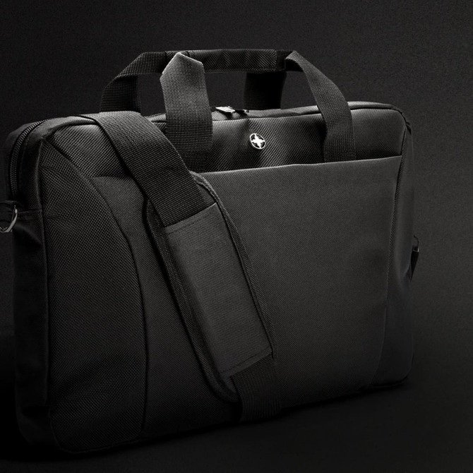 A black Swiss Peak 38cm laptop bag with dual handles and a detachable shoulder strap. Features a solid design and logo.