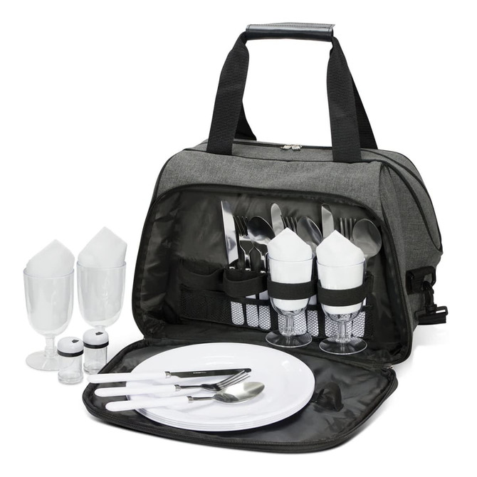 A grey picnic bag contains cutlery, plates, glasses, and salt and pepper shakers, neatly organized inside.