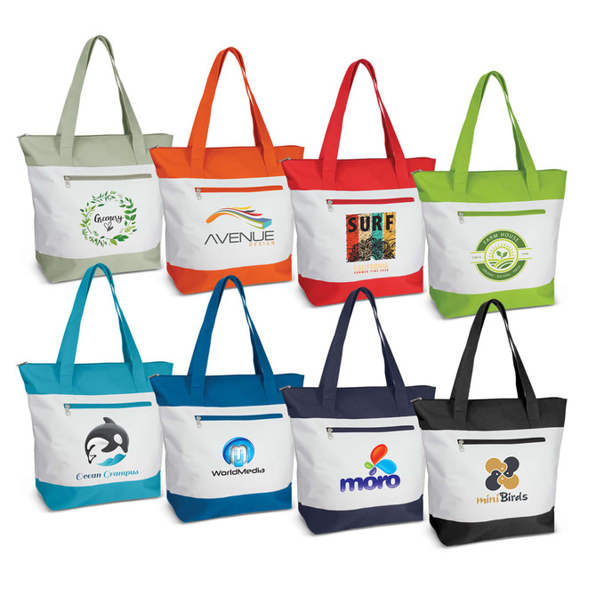 A collection of eight fabric tote bags in various colours, each featuring a different logo on the front.