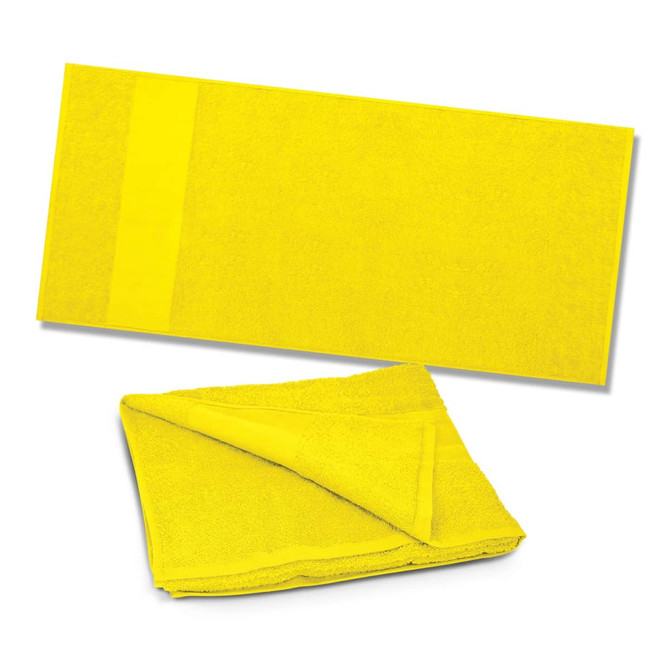 A bright yellow beach towel, folded and unfolded, made from soft, absorbent material.