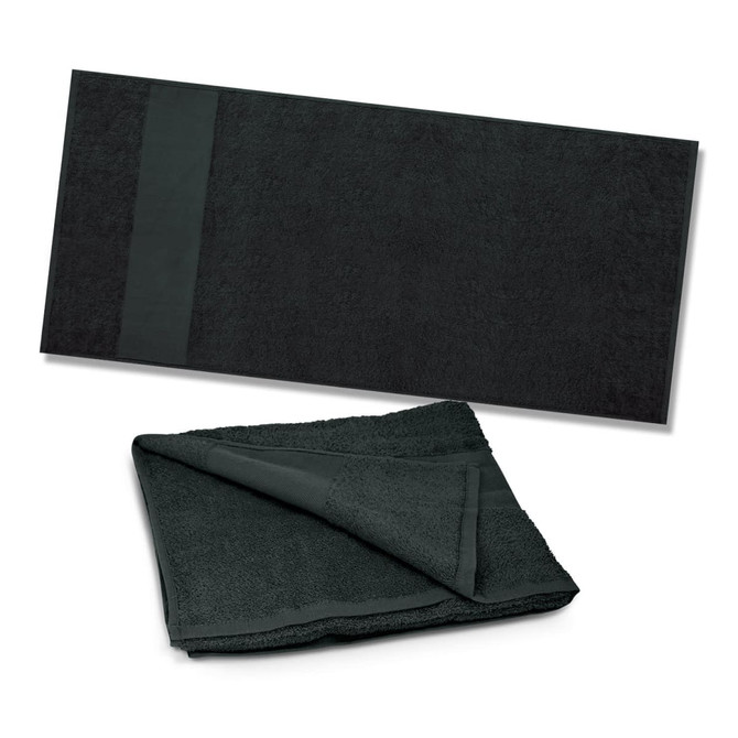 A dark green beach towel displayed flat, with a folded version showing its texture and thickness. It features a logo.