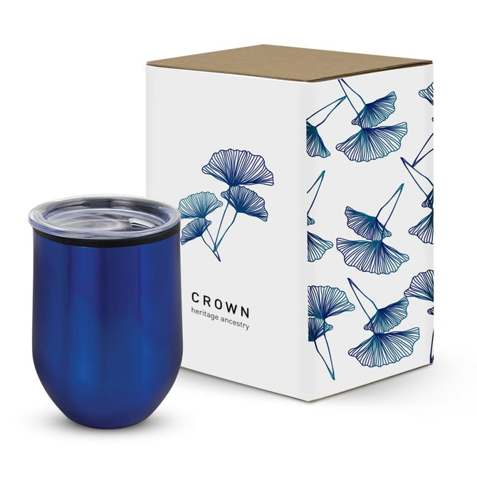 A drink bottle in a deep blue hue with a clear lid, next to a floral patterned box. The box features a logo.