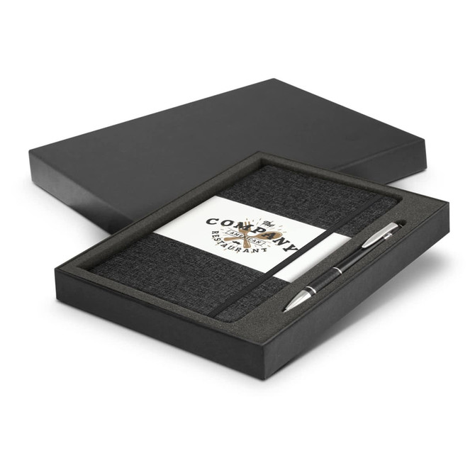A grey notebook and silver pen gift set presented in a black box with a branded interior.