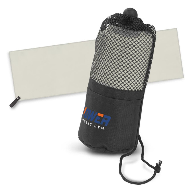 A black gym towel in a mesh pouch, featuring a branding logo, with a light grey background.