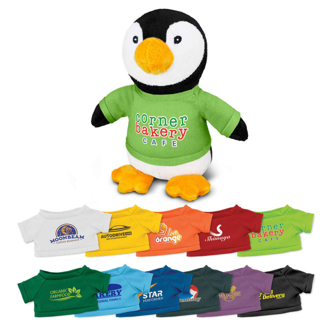 A plush penguin toy wearing a green shirt, surrounded by various small shirts in different colours and designs.