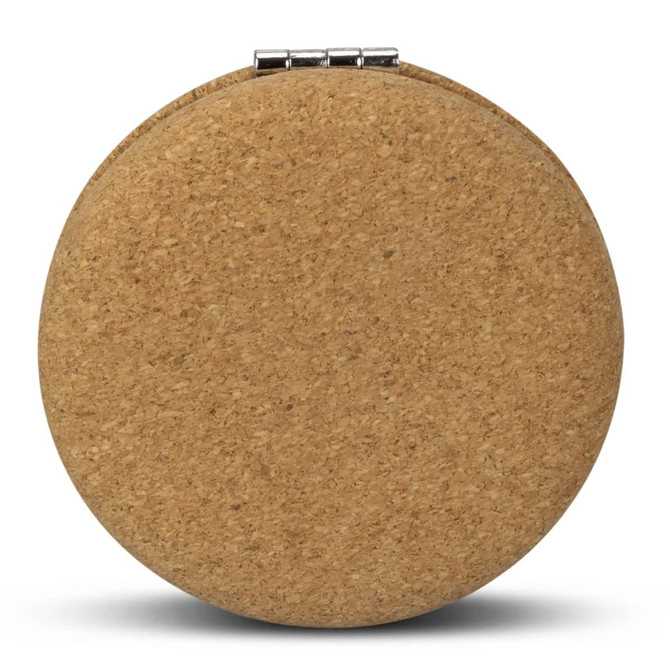 A round compact mirror with a natural cork exterior and a silver clasp.