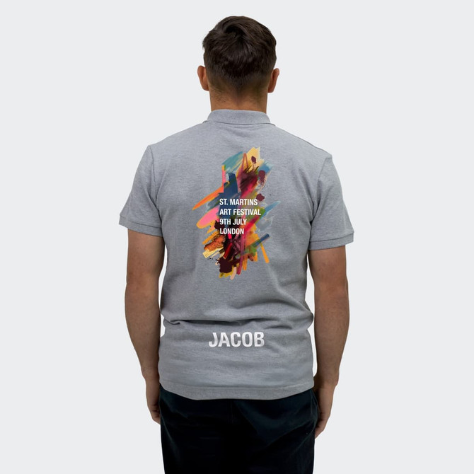 A grey men's polo shirt featuring a colourful design on the back and a logo at the bottom.