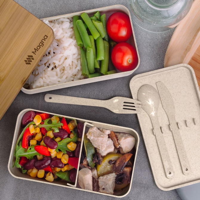 A stackable lunch box in neutral tones, featuring compartments with rice, vegetables, and salad, along with a bamboo lid.