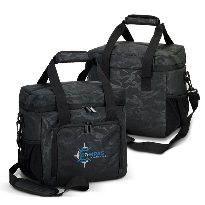 A black and grey camouflage cooler bag with shoulder straps and a front pocket. Contains a logo.
