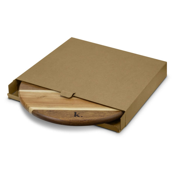 A wooden Lazy Susan featuring a mix of light and dark wood tones, presented in a simple brown cardboard box.