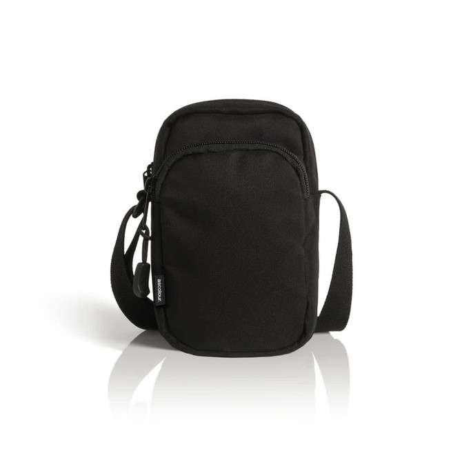 A black recycled camera bag with a zippered front pocket and an adjustable shoulder strap. It features a logo.