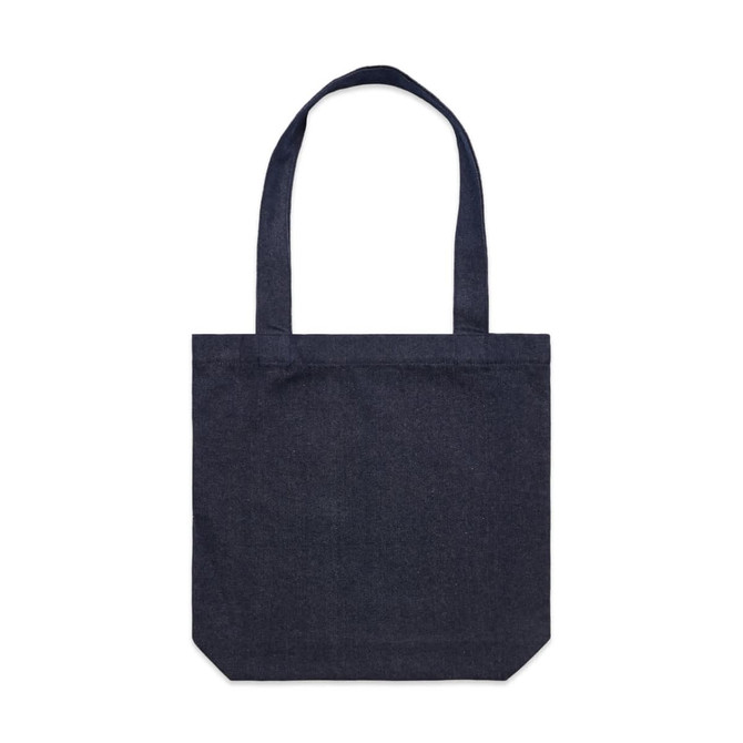A dark denim tote bag with dual handles and a square bottom. It features a subtle logo on the front.