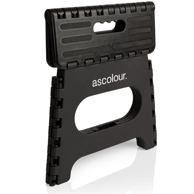 A black folding utility stool with a handle and a textured surface, featuring a logo on the front.