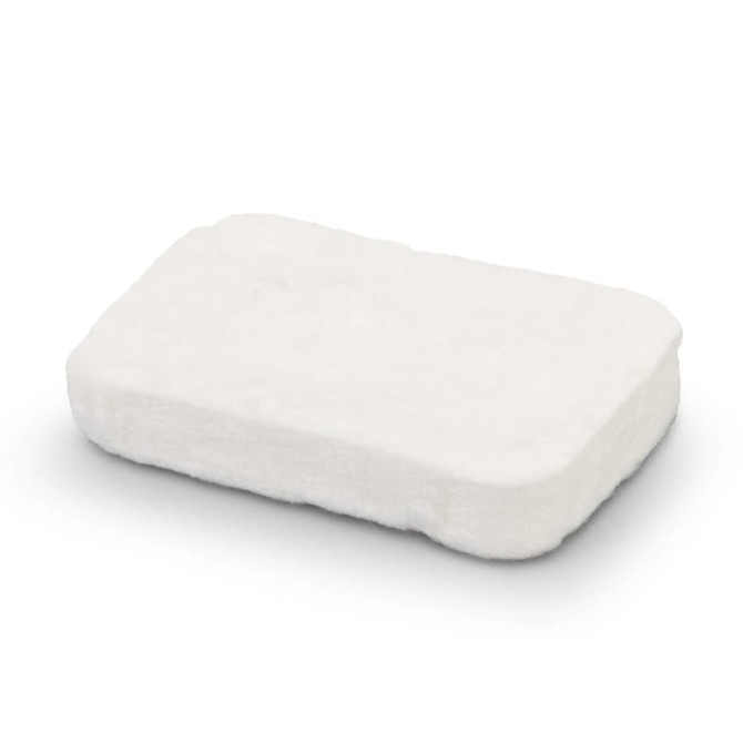 A small, rectangular, compressed white towel product with a smooth texture. It features a logo on one side.