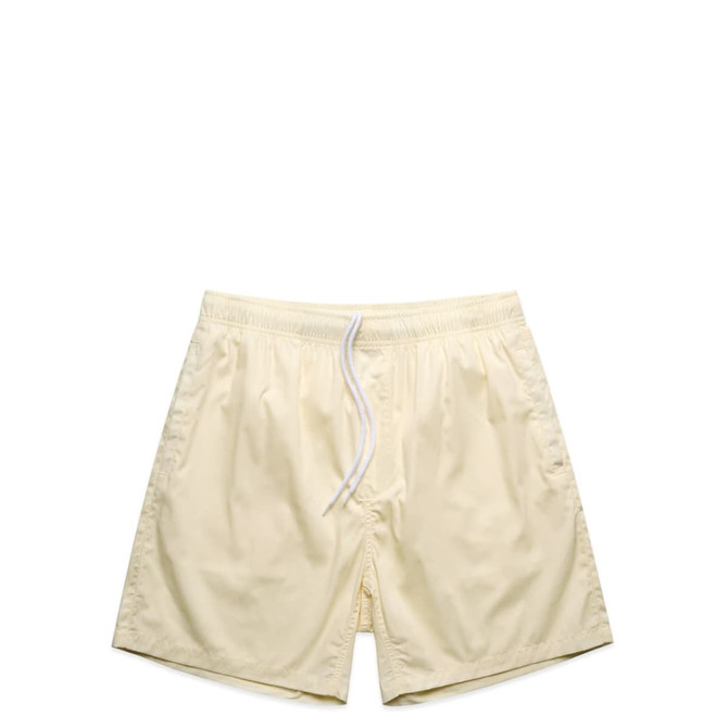 Light yellow beach shorts featuring an elastic waistband and drawstring, with a logo on the side.