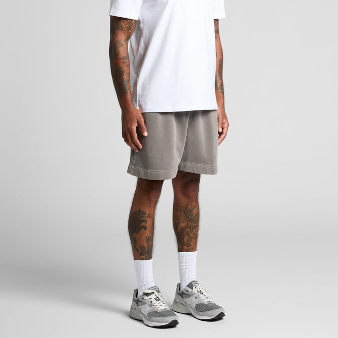 Faded grey track shorts with an elastic waistband, modelled by a person wearing a white T-shirt and trainers.