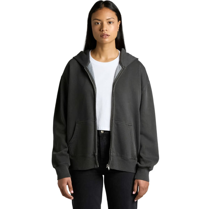 A woman wearing a faded dark grey zip hoodie, featuring a front pocket and a logo.