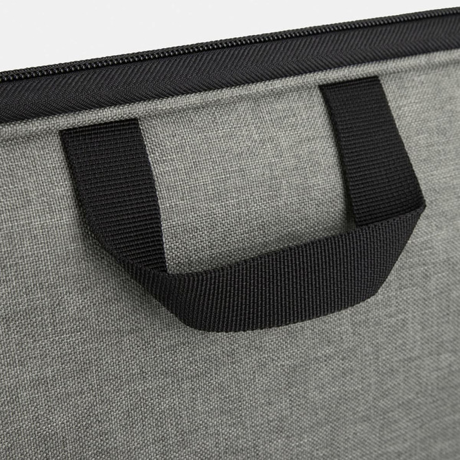 A grey satchel with a black handle, featuring a textured fabric and zipper closure. It has a logo on the material.