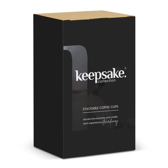 A black box containing a set of two stackable coffee cups. The product features a logo.