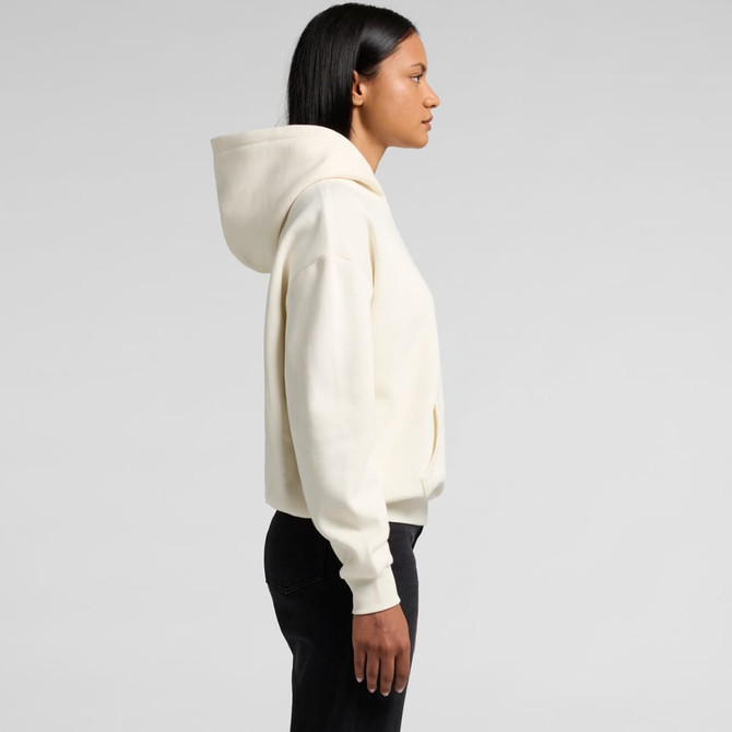A cream-coloured hoodie with a hood, featuring a loose fit and a front pocket. It has a logo on the garment.