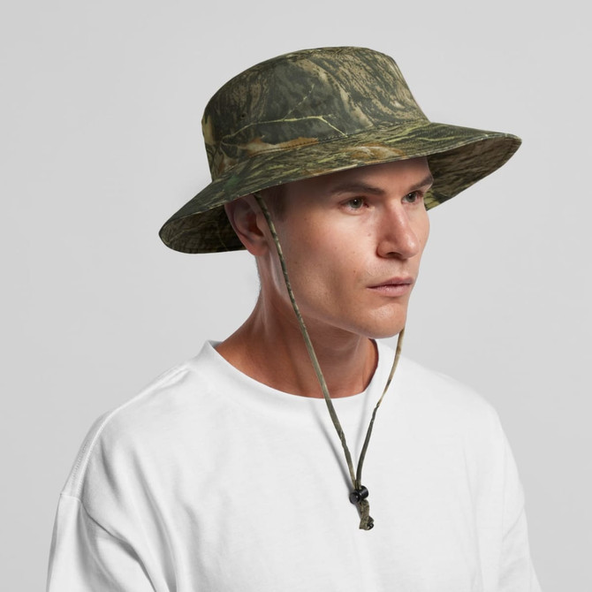 A wide brim bucket hat in a camouflage pattern, featuring a drawstring for secure wear.