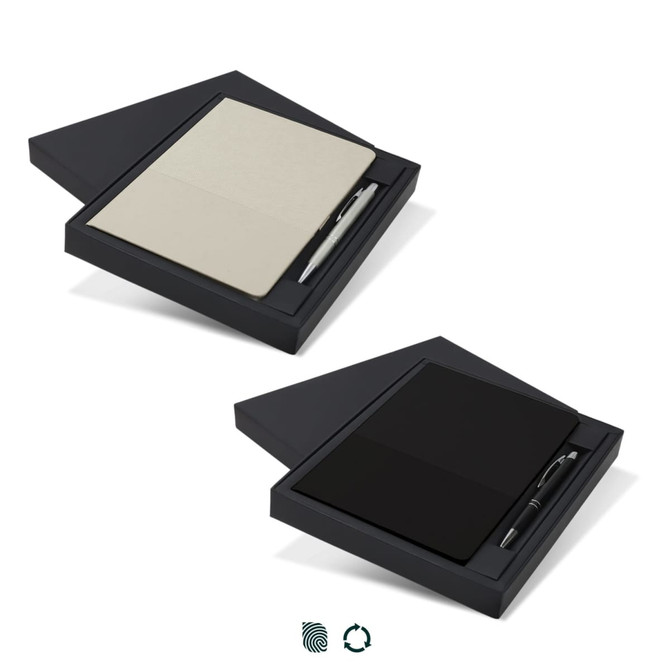 A gift set featuring a black notebook with a cream interior and a sleek black pen, presented in a stylish box.