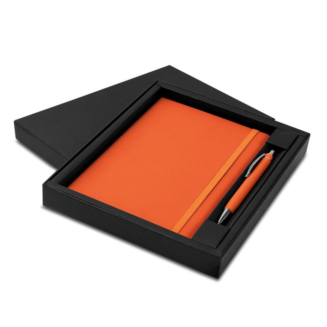 An orange notebook and pen set in a black box with a logo.