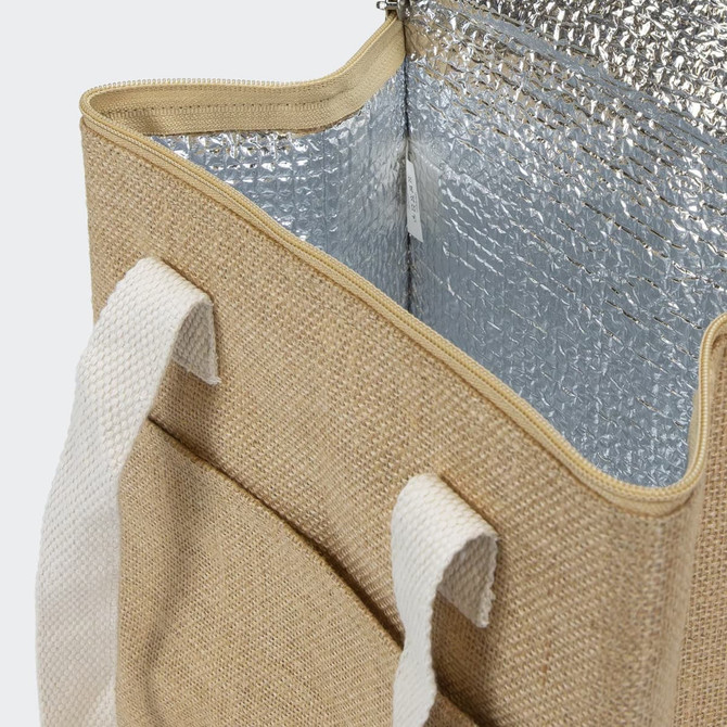 A beige cooler bag with white straps, featuring a silver insulated interior and an exterior pocket.