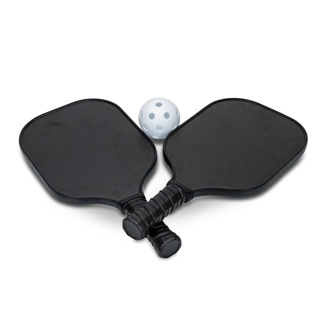 Two black pickleball paddles and a white perforated ball, arranged together. The paddles have grips and a logo.