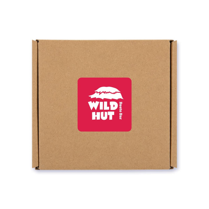 A brown cardboard box with a red label featuring a logo for "Wild Hut Resto Bar."