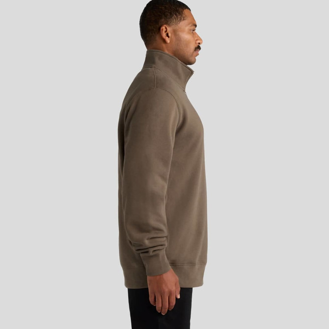 A brown half-zip crew jumper, featuring a stand-up collar and a side view of a model. The garment has a logo.