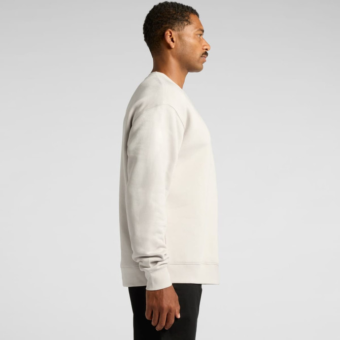 A light grey crew jumper featuring long sleeves and a ribbed hem, displayed on a model in profile.