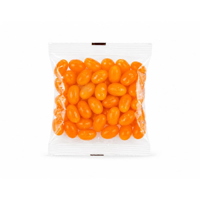 A clear cello bag filled with bright orange jelly beans.