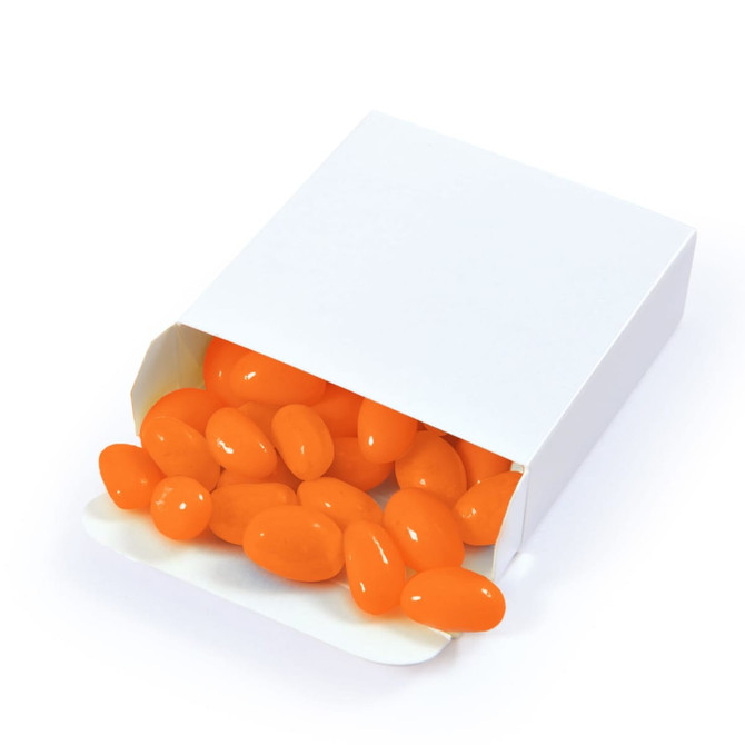 An open white box filled with bright orange jelly beans spilling out.