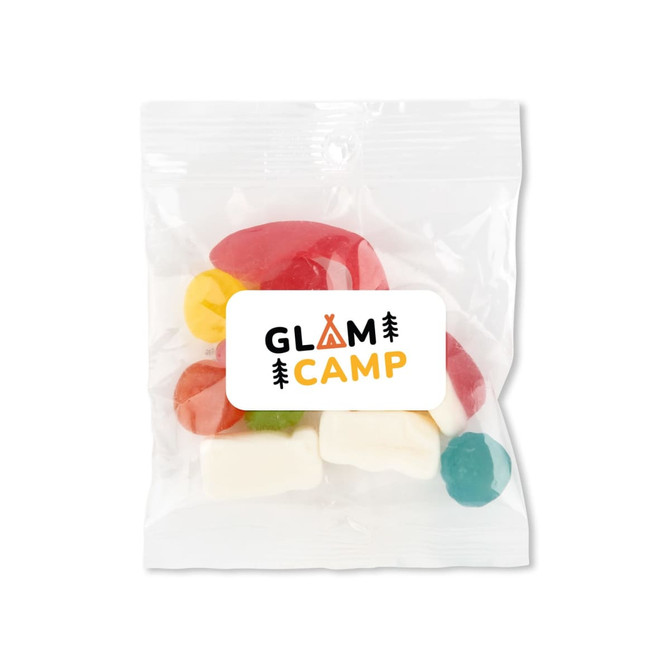 A clear plastic bag containing assorted coloured gummy candies, with a logo on the front.