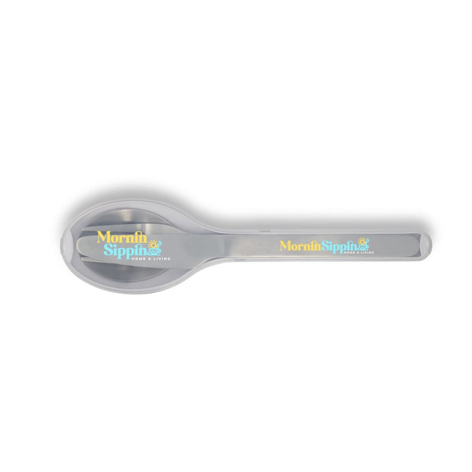 A silver spoon with a rounded end and a handle featuring a logo. The spoon has a shiny finish.
