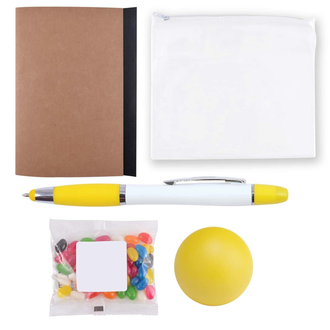 A notebook, a clear zip pouch, a pen with a yellow cap, a bag of colorful jelly beans, and a stress ball.