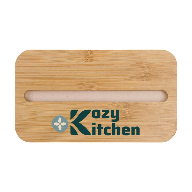 A bamboo lunch box lid with a phone holder slot and a logo in dark green.