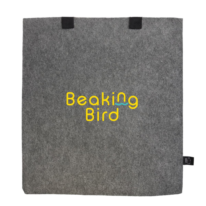 A grey felt tote bag with black handles and a logo prominently displayed in yellow and blue.