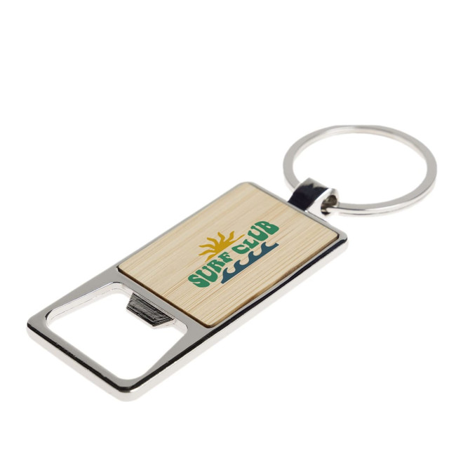 A drink bottle opener keytag with a bamboo and silver design, featuring a logo.