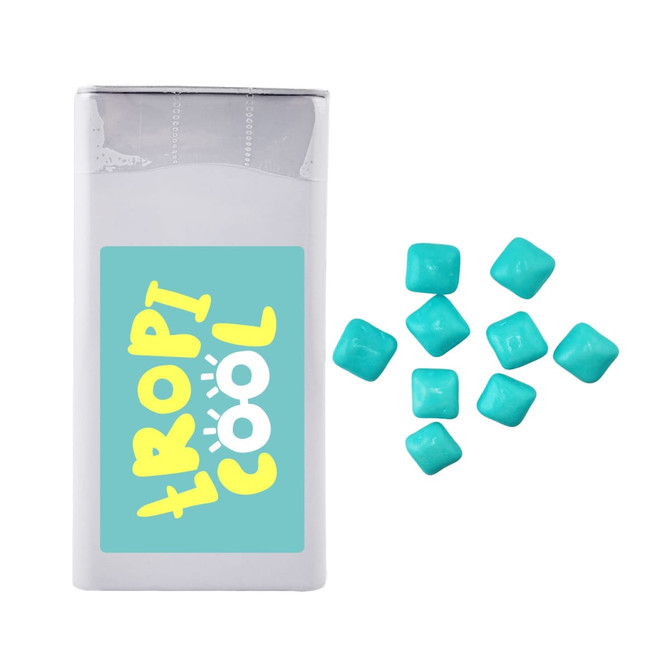 A rectangular package of mints in white, with several turquoise square mints scattered beside it. The package has a logo.