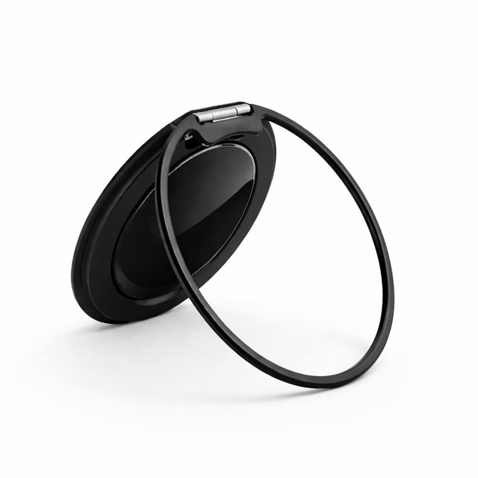 A black phone grip and stand with a circular design and integrated ring for added functionality.